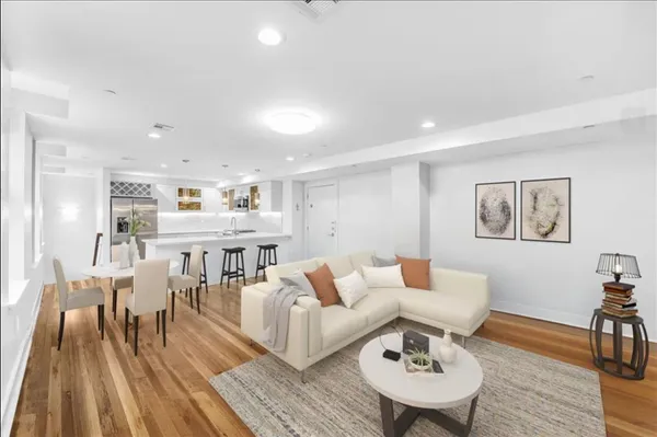 a living room with furniture and a table
