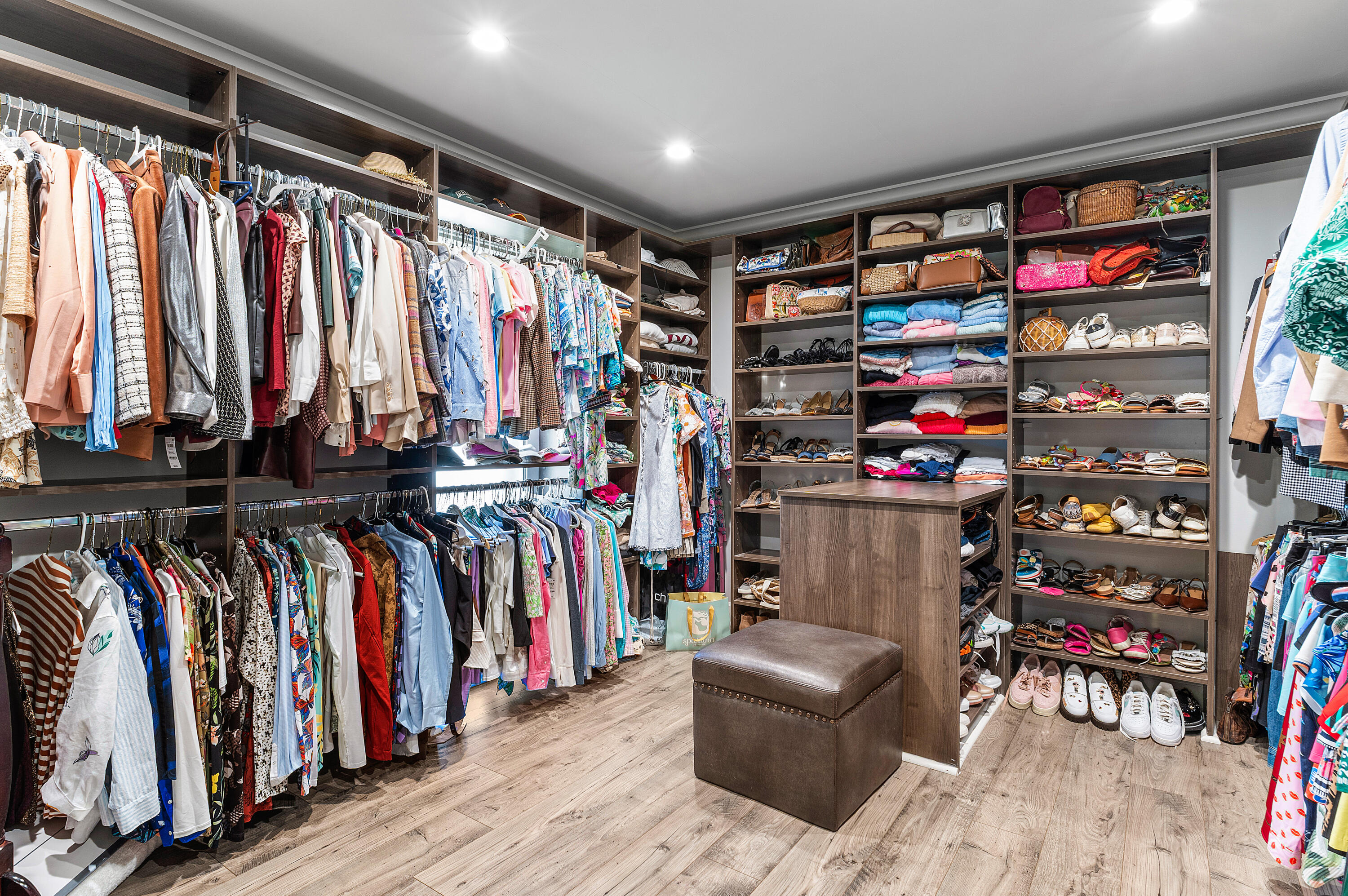 629 Cypress Key Circle Atlantis, FL 33462 - Photo 38 of 67 a view of walk in closet with clothes