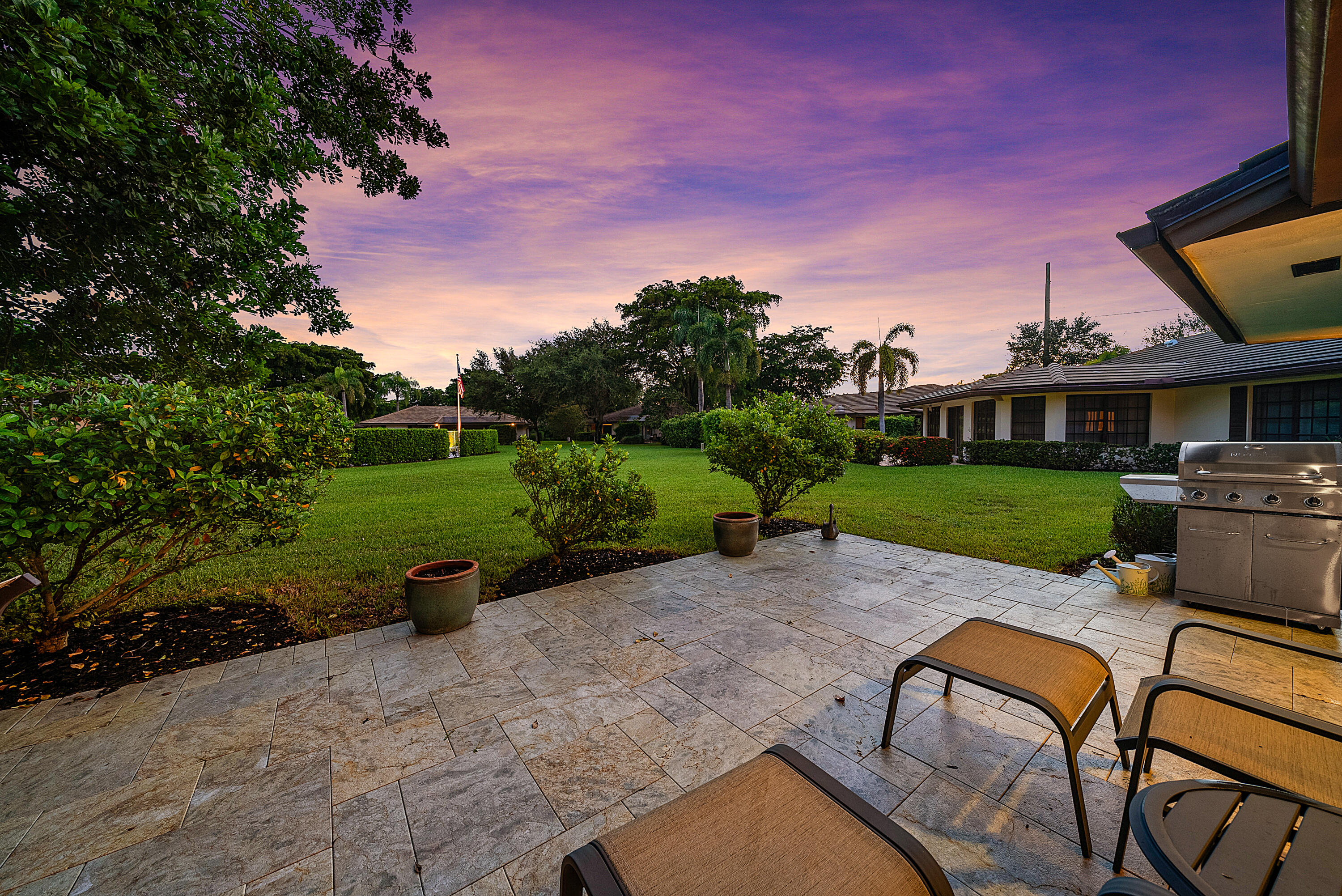 629 Cypress Key Circle Atlantis, FL 33462 - Photo 44 of 67 a view of a backyard with sitting area