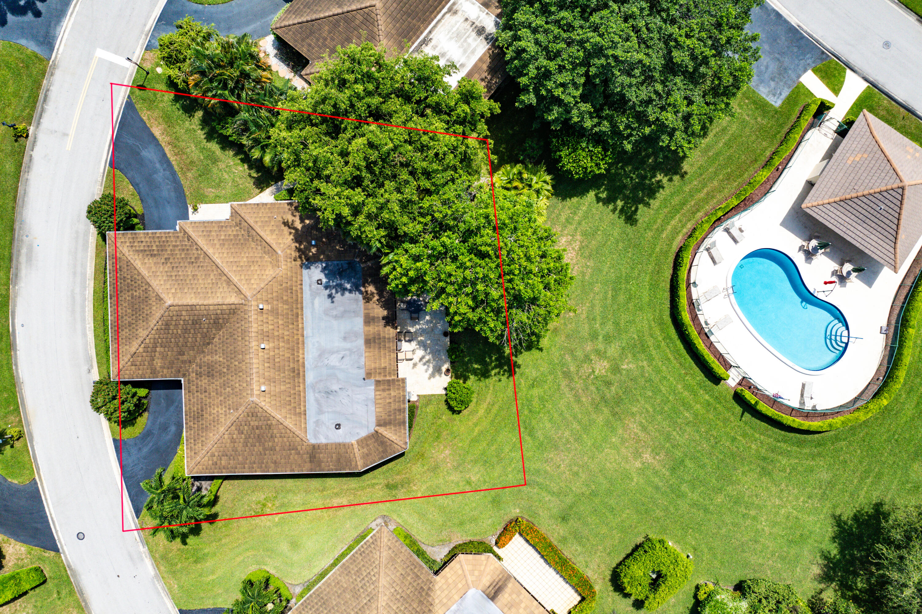 629 Cypress Key Circle Atlantis, FL 33462 - Photo 58 of 67 an aerial view of a house with swimming pool and garden