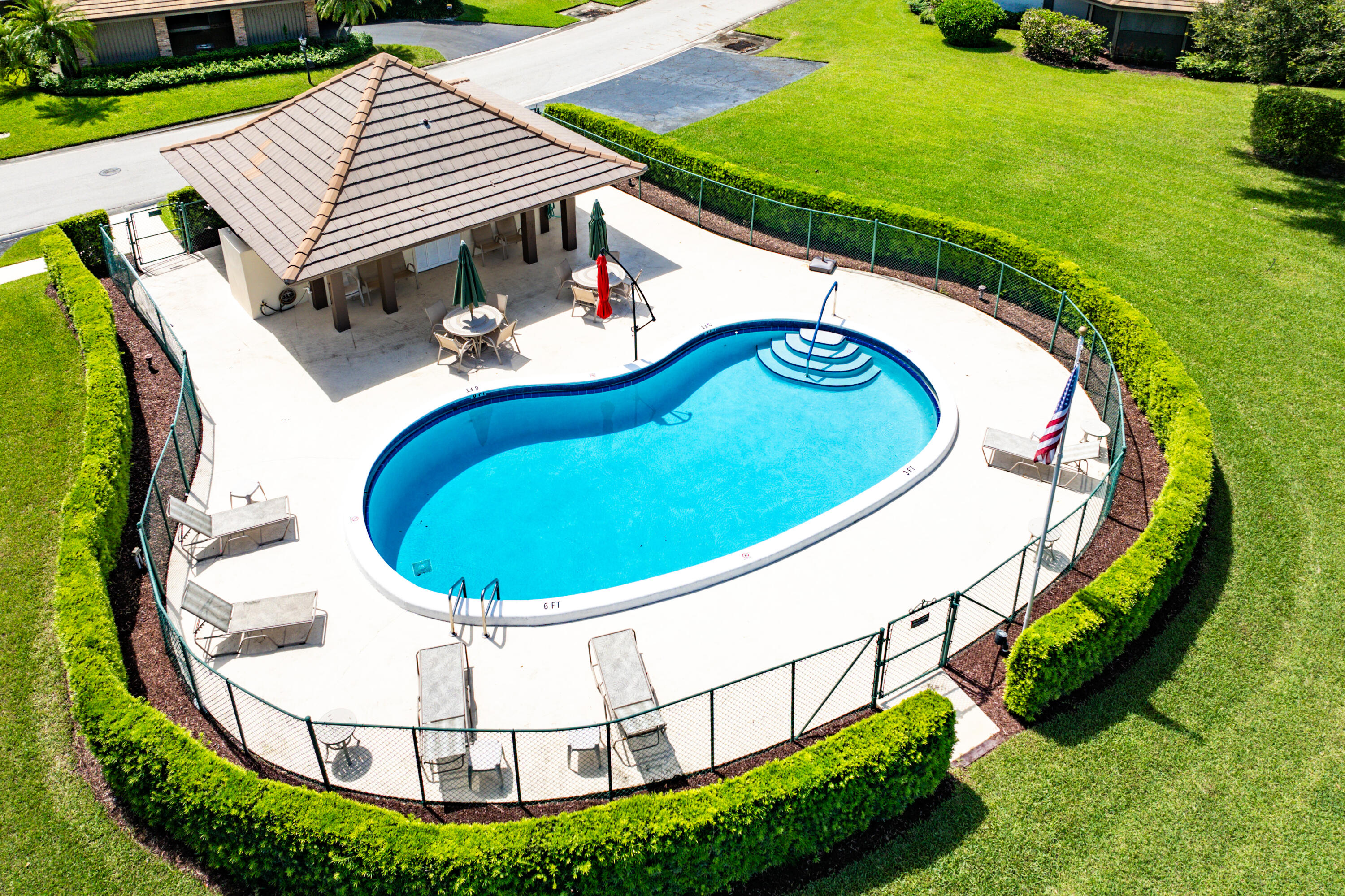 629 Cypress Key Circle Atlantis, FL 33462 - Photo 66 of 67 an aerial view of a swimming pools and fire pit