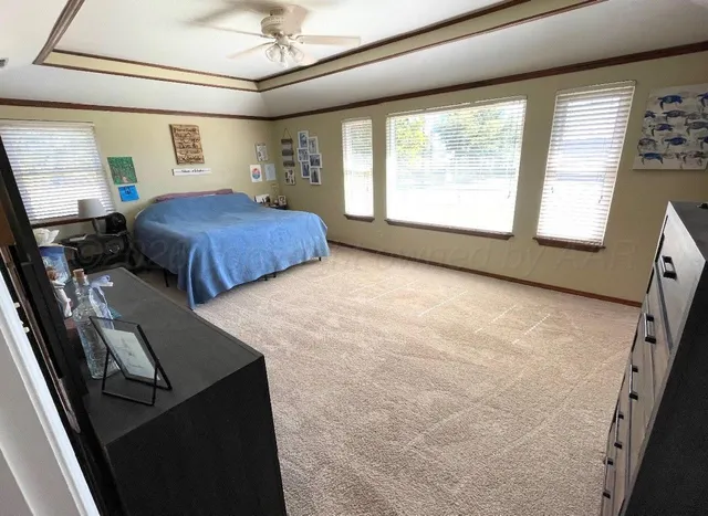 a bedroom with furniture and window