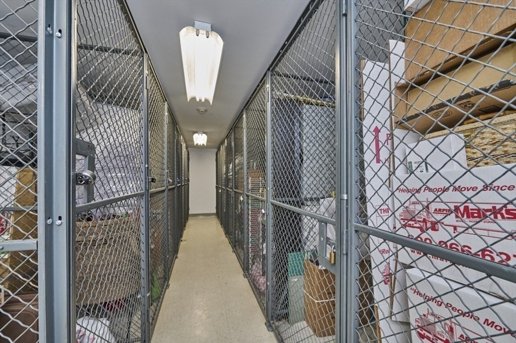 193 Oak Street, Unit 403 Newton, MA 02464 - Photo 17 of 21 a view of a hallway with wooden floor