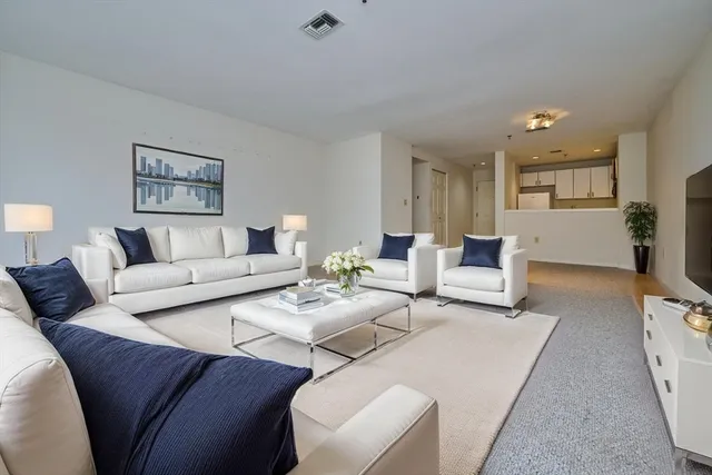 a living room with furniture and a table