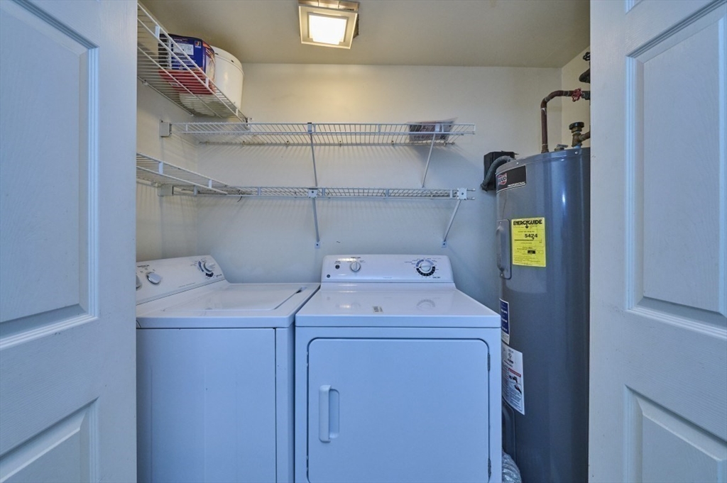 193 Oak Street, Unit 403 Newton, MA 02464 - Photo 7 of 21 a utility room with dryer and washer