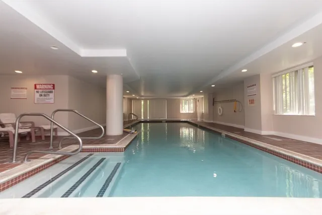 a view of a swimming pool and a balcony