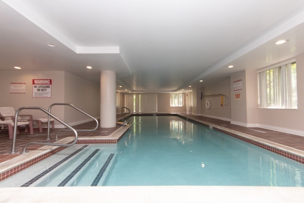 193 Oak Street, Unit 403 Newton, MA 02464 - Photo 8 of 21 a view of a swimming pool and a balcony