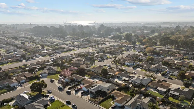 an aerial view of residential house with green space