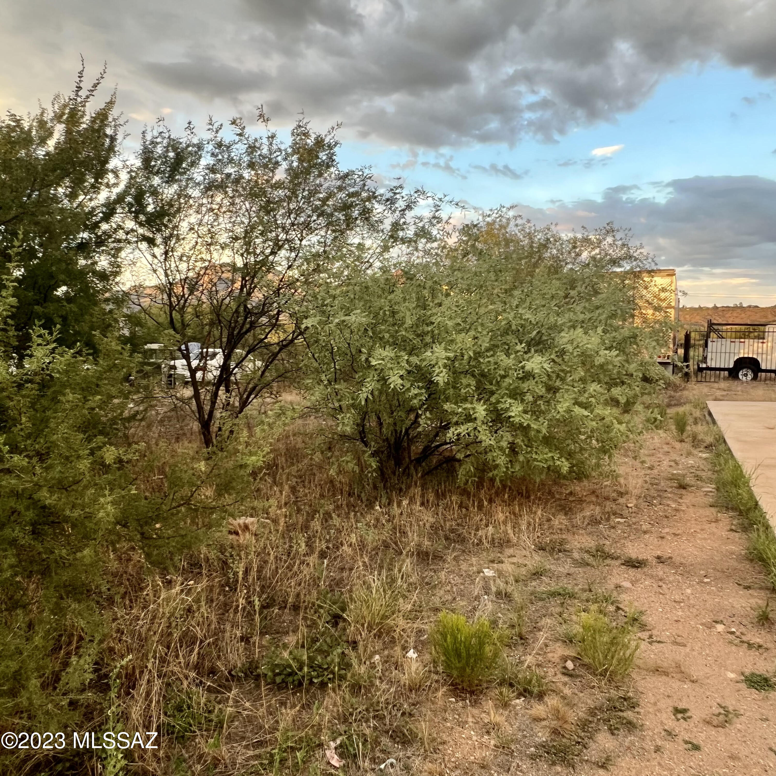 1217 West Frontage Road Rio Rico, AZ 85648 - Photo 8 of 18 a view of a pathway both side of yard
