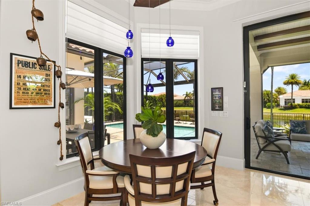2220 Residence Circle Naples, FL 34105 - Photo 11 of 50 a dining room with furniture and window