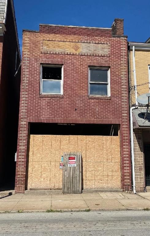a front view of a house with a garage