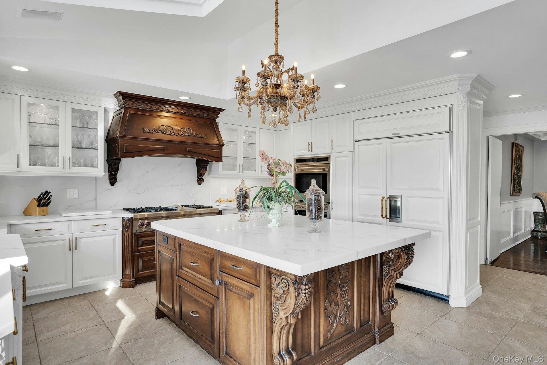 10 Beech Road Islip, NY 11751 - Photo 16 of 49 Carved center island with granite counters is the heart of the kitchen.
