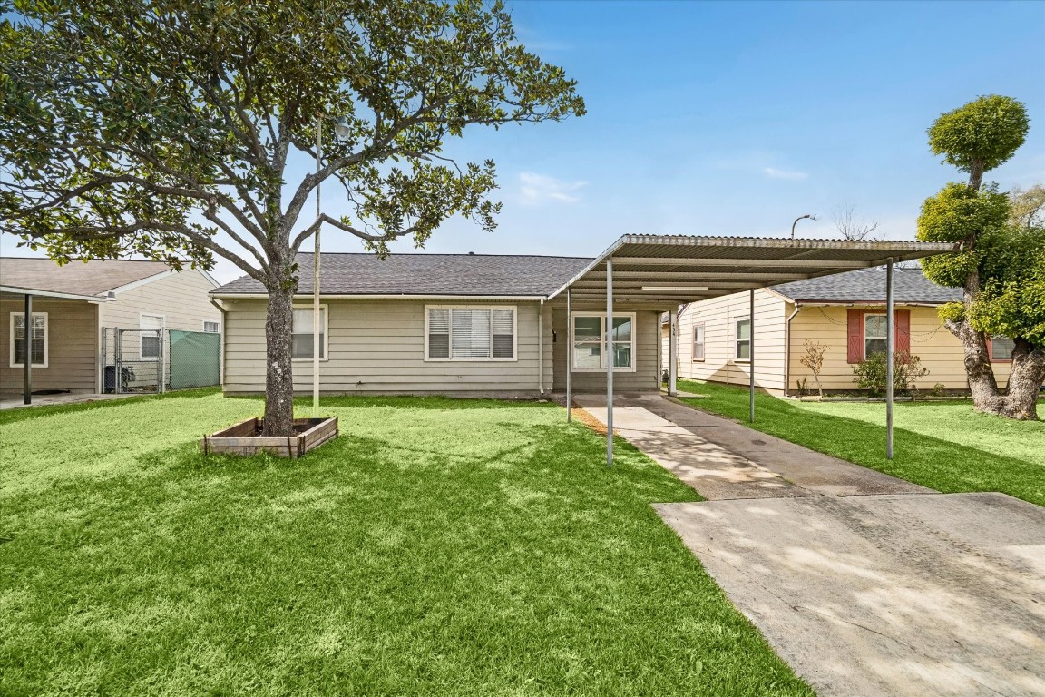 434 Meters Street Houston, TX 77020 - Photo 1 of 10 a front view of a house with a yard and garage