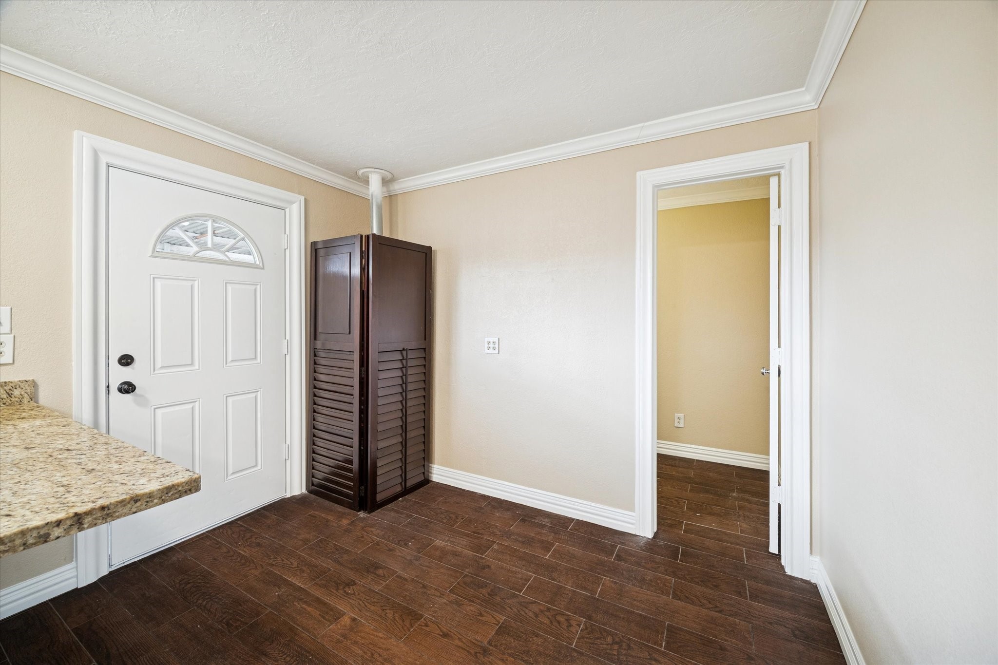 434 Meters Street Houston, TX 77020 - Photo 4 of 10 a view of an empty room with wooden floor