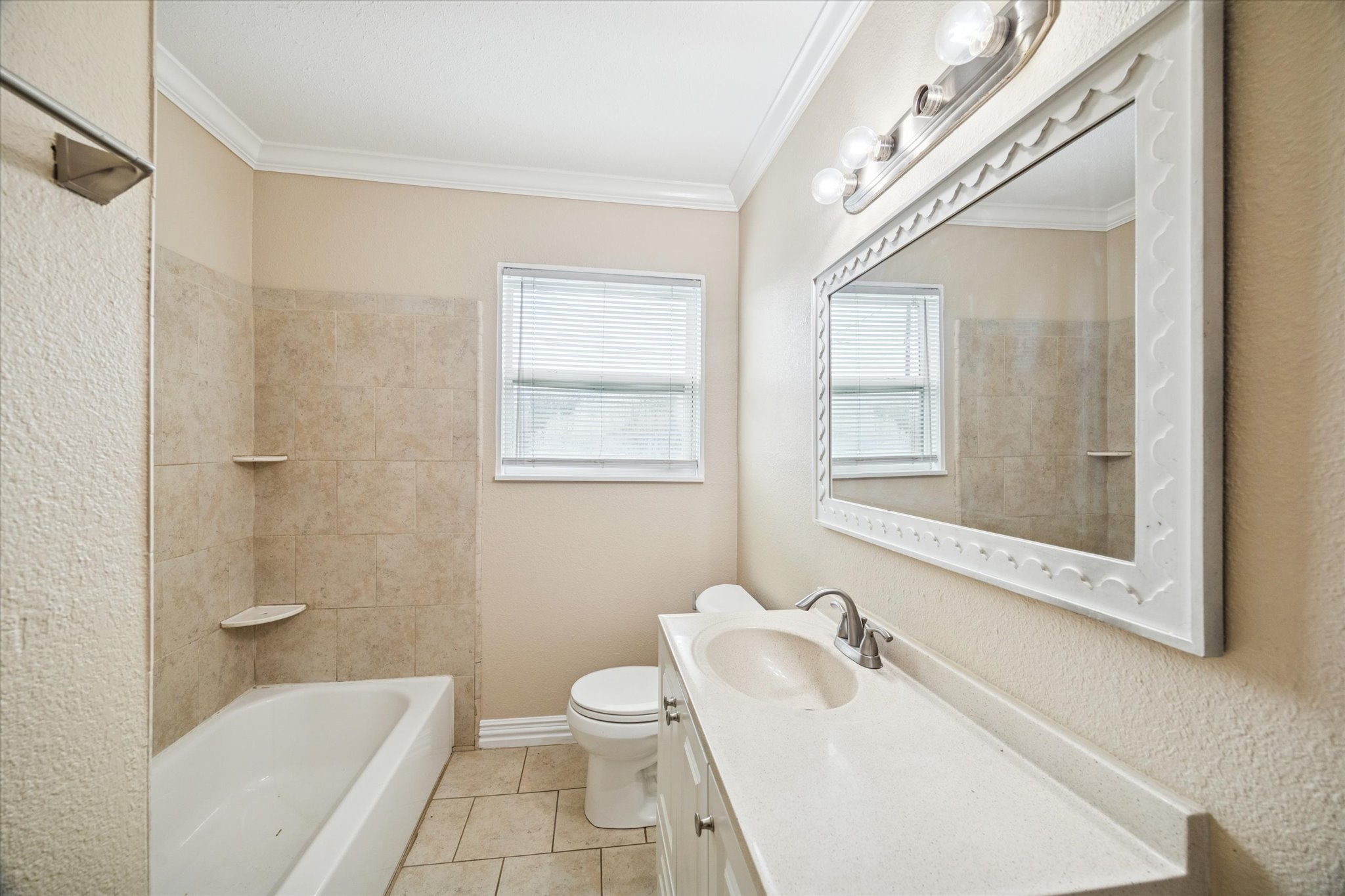 434 Meters Street Houston, TX 77020 - Photo 7 of 10 a white toilet sitting next to a bathroom sink
