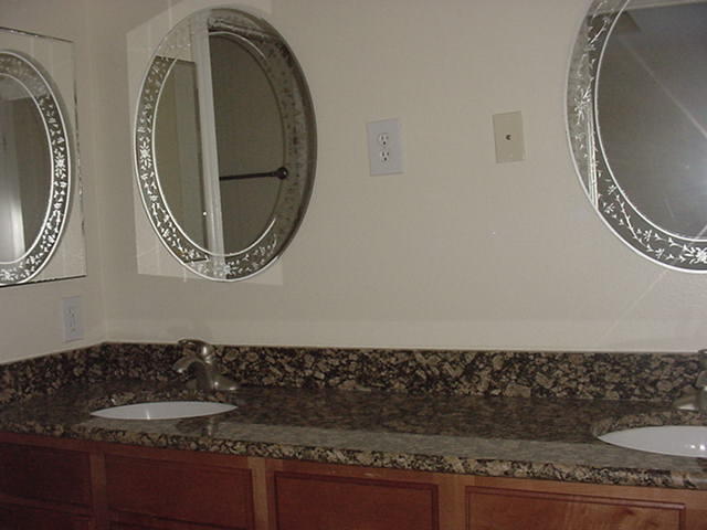 47 Bald Eagle Court Santa Rosa Beach, FL 32459 - Photo 15 of 26 a bathroom with a granite countertop and a mirror
