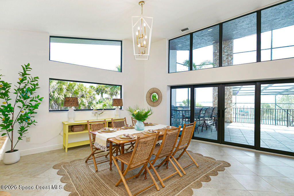 110 Barnacle Place Rockledge, FL 32955 - Photo 22 of 71 a dining room with a table and chairs