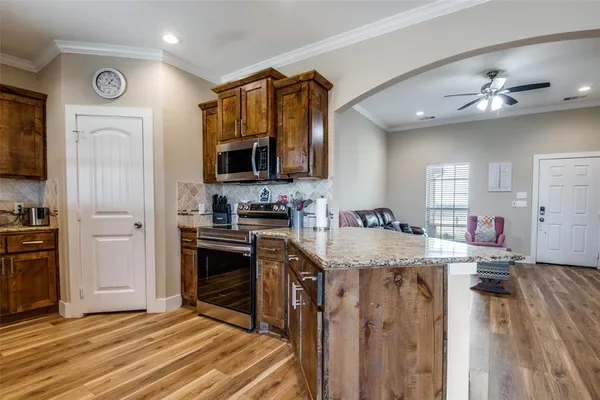 a kitchen with a stove oven and sink