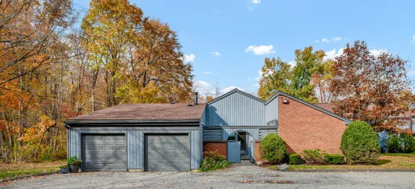a house with trees in the background