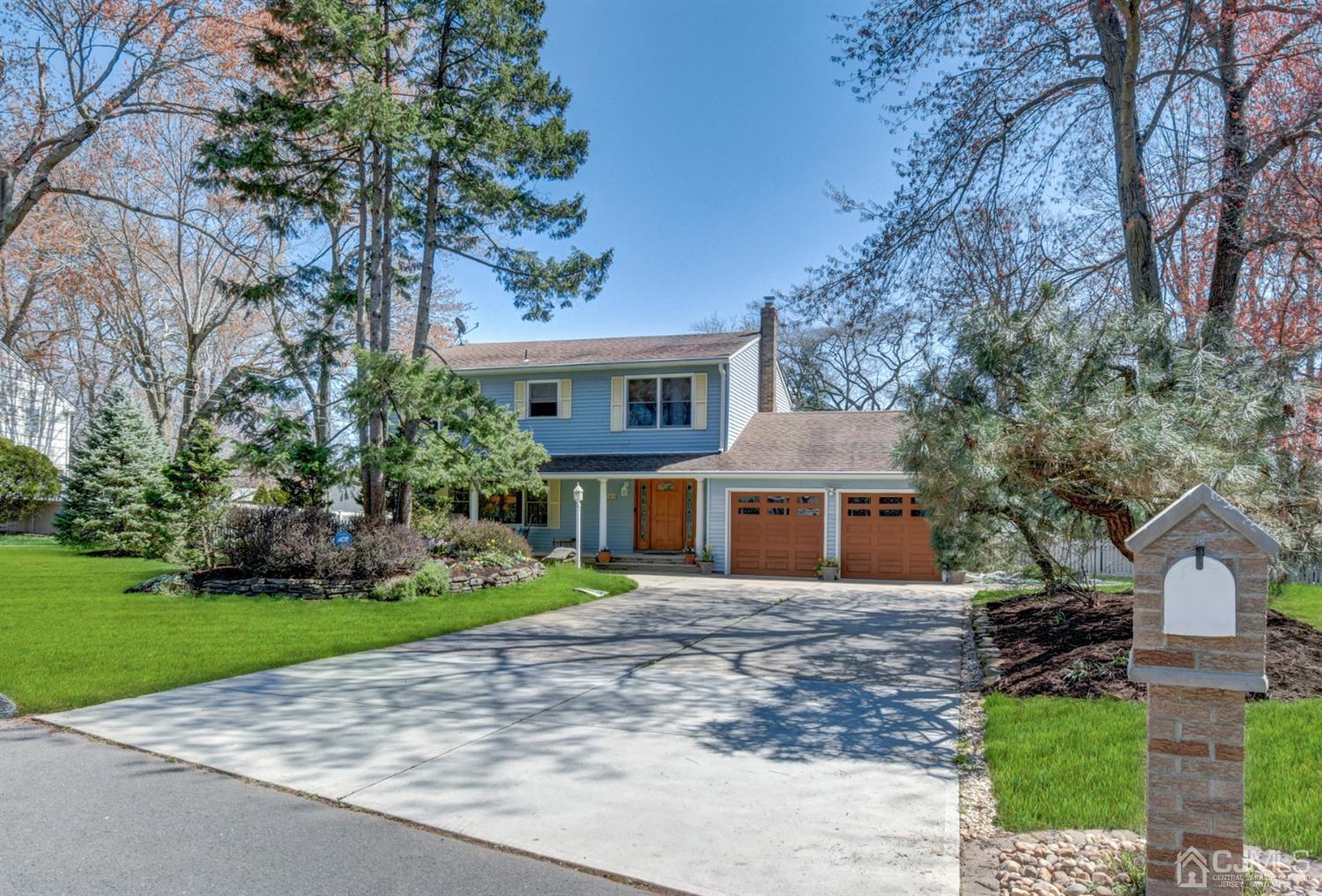 76 Pennington Road New Brunswick, NJ 08901 - Photo 2 of 32 Long concrete driveway, custom garage doors. Beautiful landscaping. Some of the many extras this home has to offer