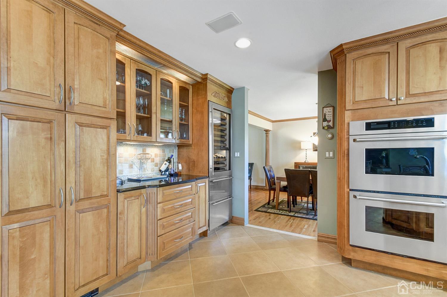 76 Pennington Road New Brunswick, NJ 08901 - Photo 13 of 32 Custom cabinetry, 78 bottle wine refrigerator , more drawers, more cabinets, more pantries