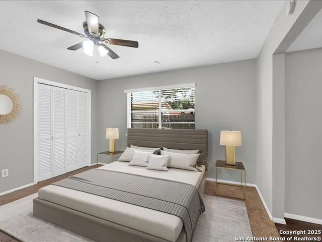 a bedroom with a bed and window