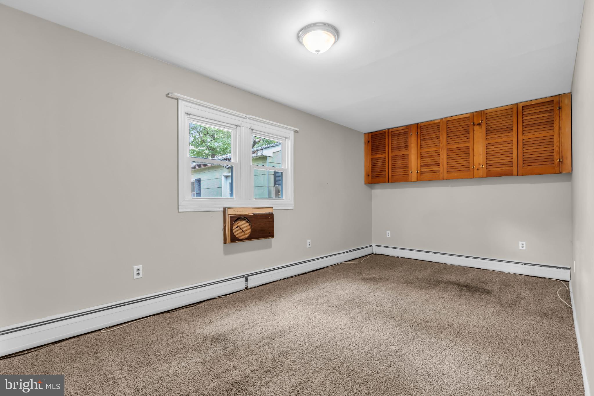 102 Sunset Street Browns Mills, NJ 08015 - Photo 16 of 27 an empty room with a empty space and windows