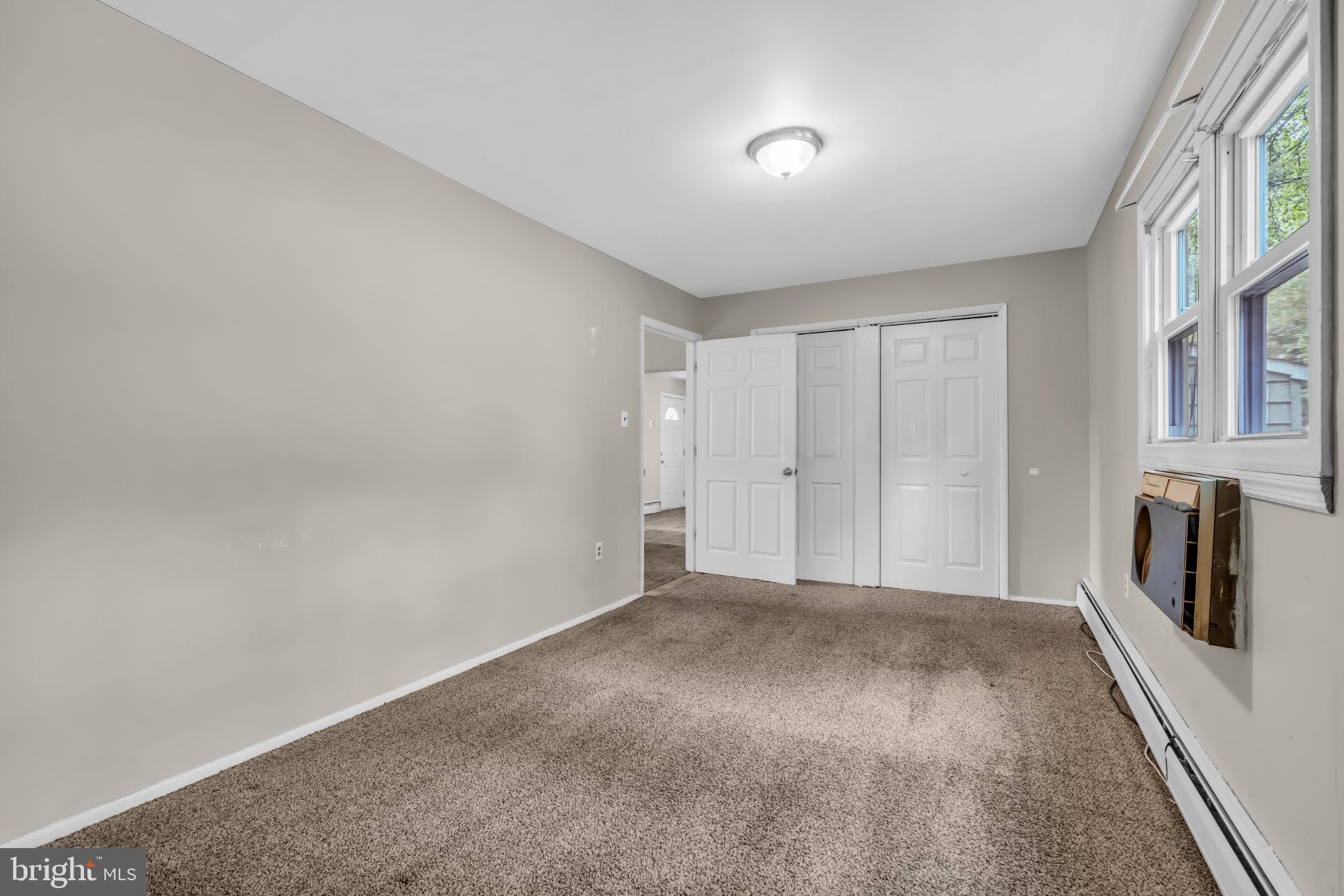 102 Sunset Street Browns Mills, NJ 08015 - Photo 17 of 27 a view of an empty room and a kitchen