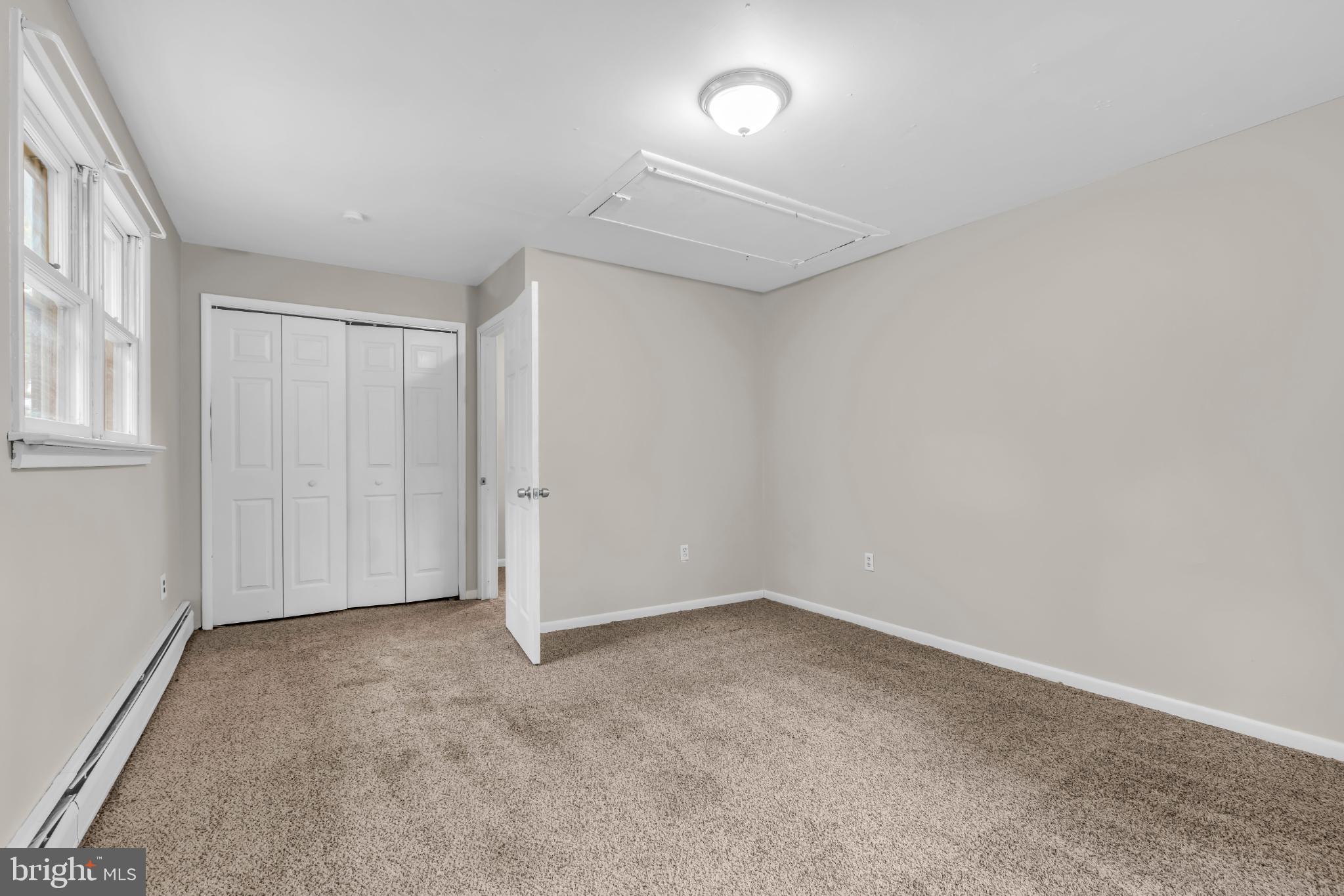 102 Sunset Street Browns Mills, NJ 08015 - Photo 21 of 27 an empty room with a empty space and windows
