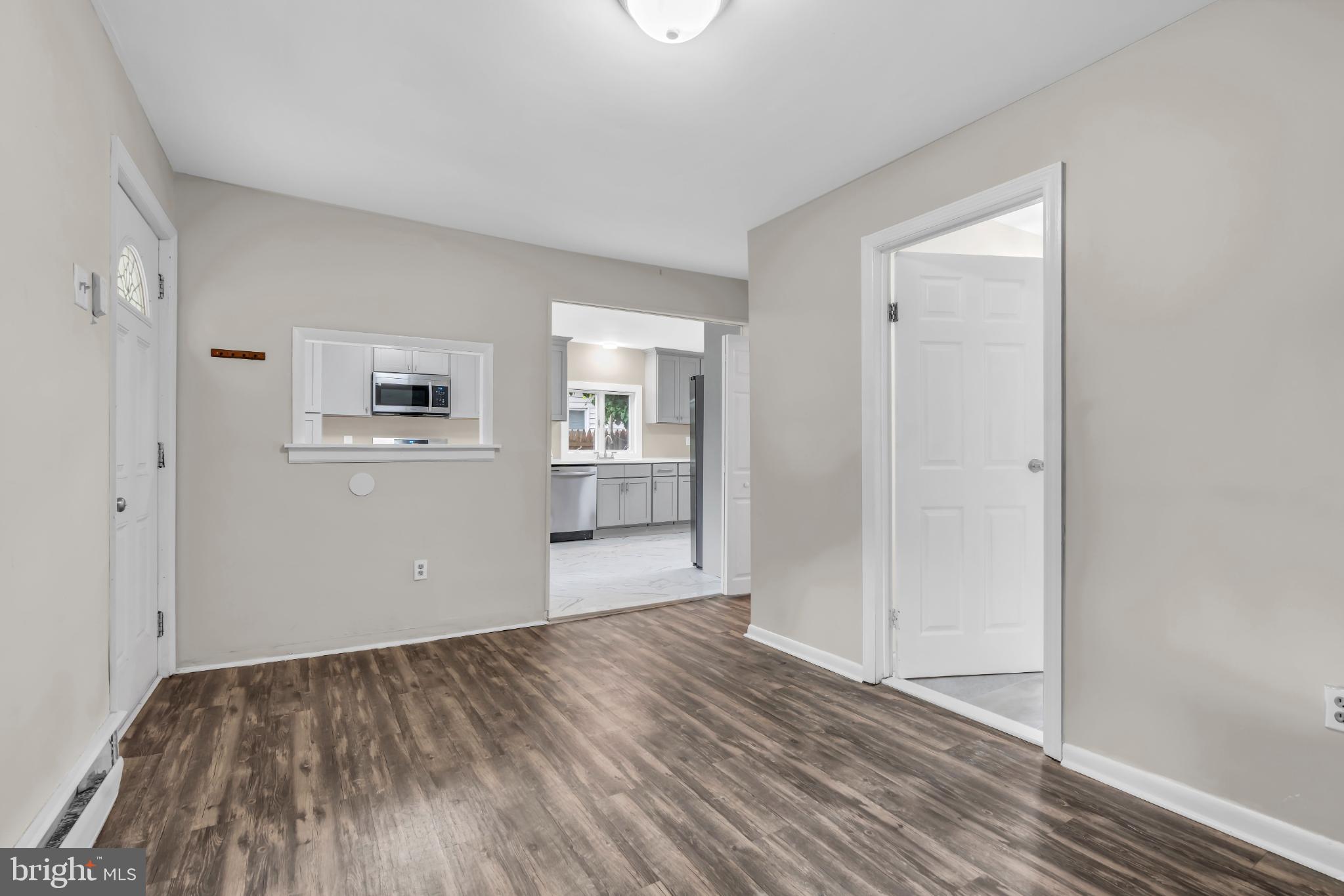 102 Sunset Street Browns Mills, NJ 08015 - Photo 7 of 27 wooden floor in an empty room with a window
