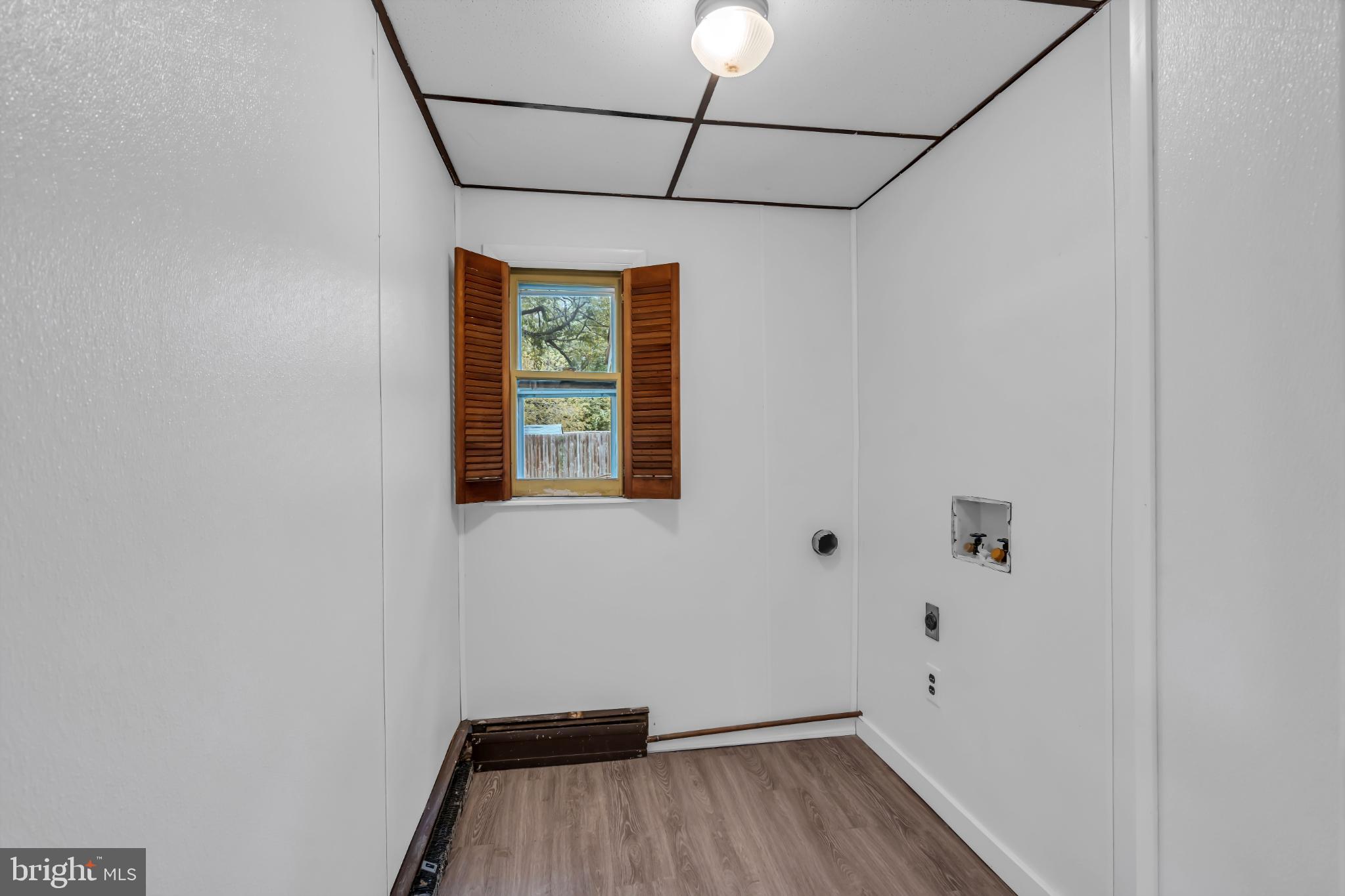 102 Sunset Street Browns Mills, NJ 08015 - Photo 9 of 27 a view of a room with wooden floor and windows