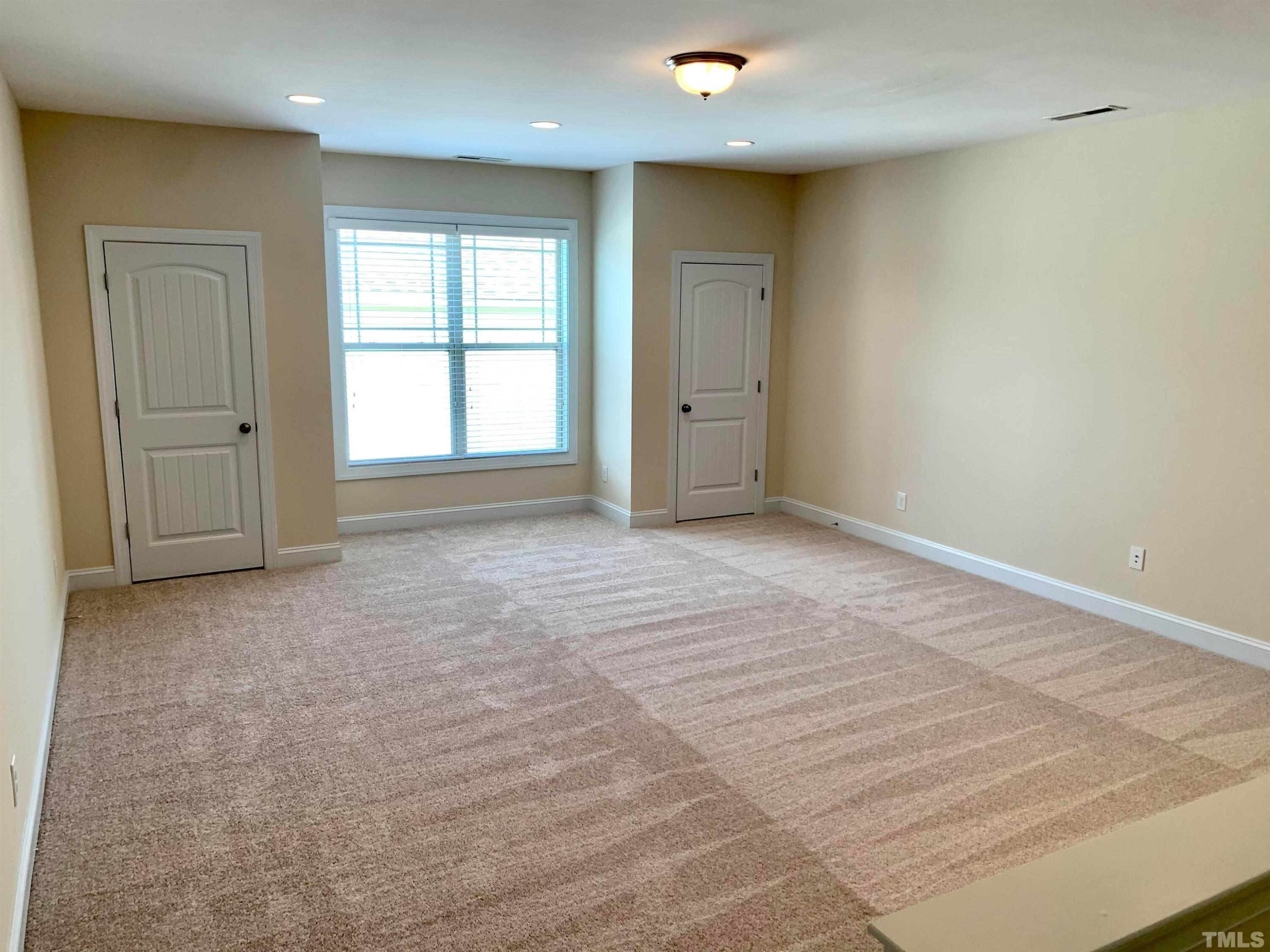 706 Weavers Ridge Drive Cary, NC 27519 - Photo 12 of 14 a view of an empty room and window