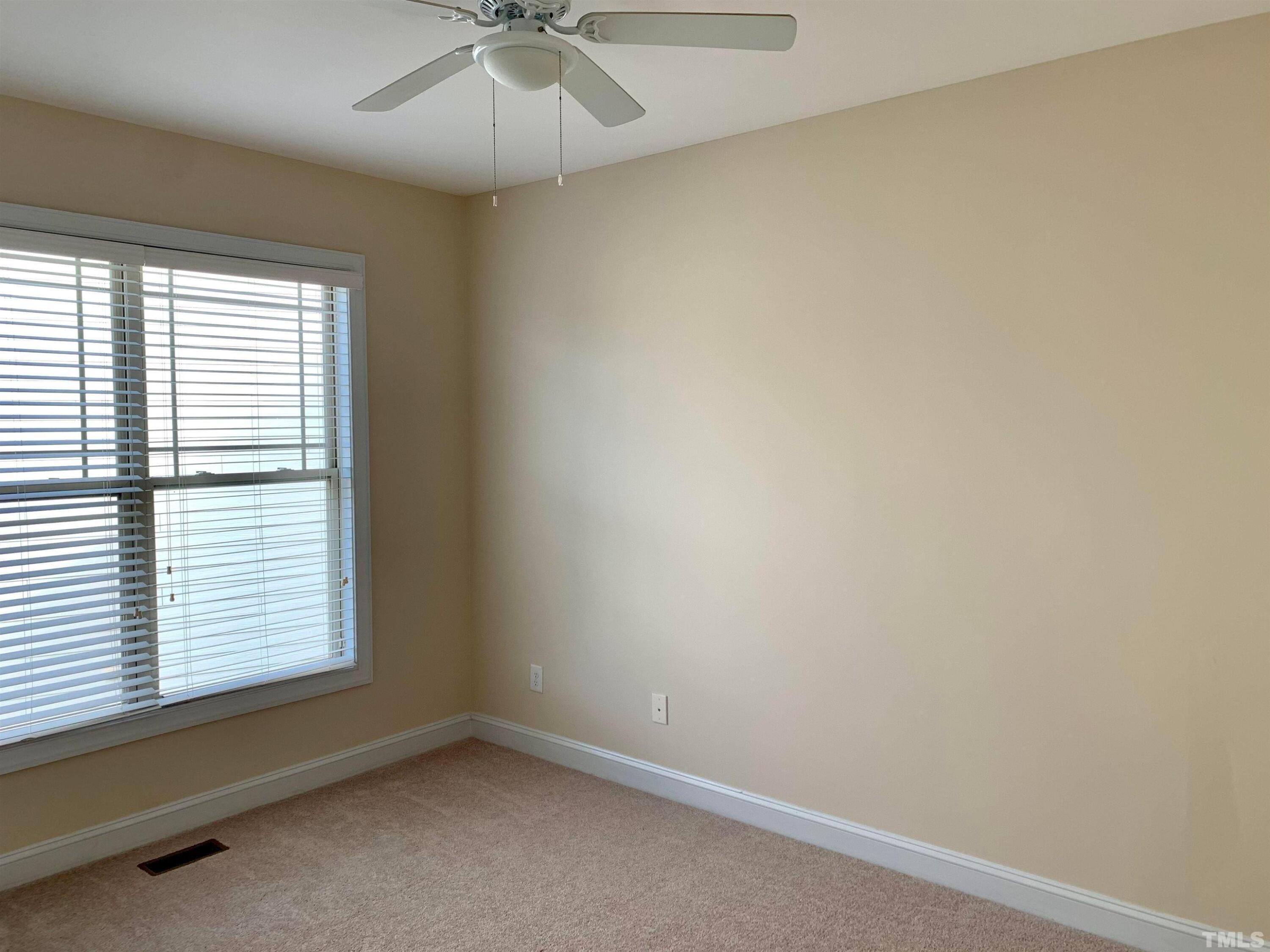 706 Weavers Ridge Drive Cary, NC 27519 - Photo 6 of 14 an empty room with a window