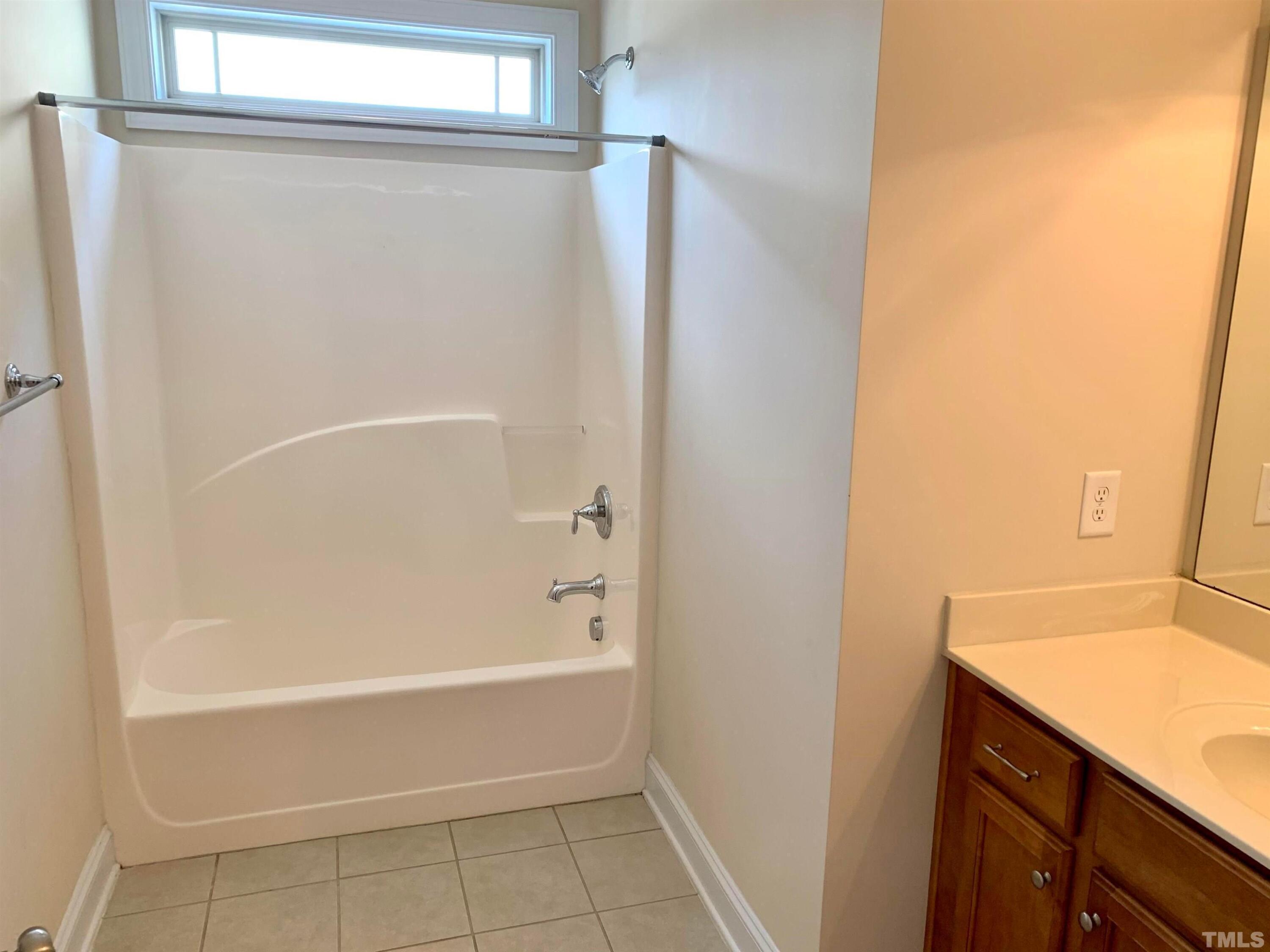 706 Weavers Ridge Drive Cary, NC 27519 - Photo 7 of 14 a bathroom with a bathtub