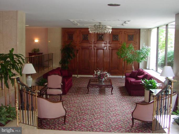 1900 Lyttonsville Road, Unit 1011 Silver Spring, MD 20910 - Photo 2 of 10 a living room filled with furniture