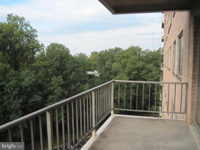 1900 Lyttonsville Road, Unit 1011 Silver Spring, MD 20910 - Photo 5 of 10 a balcony with an outdoor space