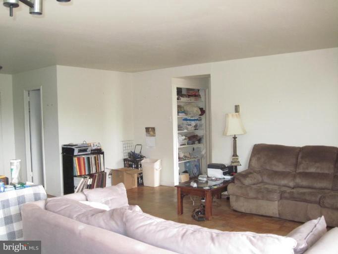 1900 Lyttonsville Road, Unit 1011 Silver Spring, MD 20910 - Photo 6 of 10 a living room with furniture and a couch