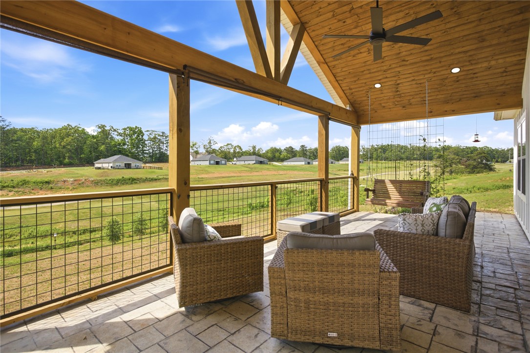 412 Chadwick Lane Walhalla, SC 29691 - Photo 27 of 37 This outdoor patio provides ample space for relaxation and enjoyment, with a natural wood ceiling and a scenic, open field view.