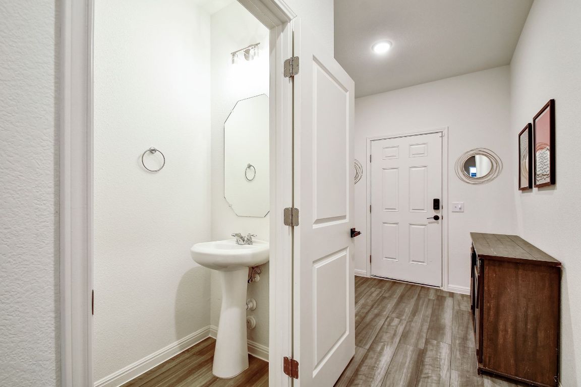 414 Plateau Street Maxwell, TX 78656 - Photo 10 of 25 a bathroom with a sink and mirror