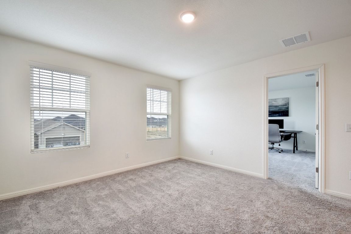 414 Plateau Street Maxwell, TX 78656 - Photo 11 of 25 an empty room with windows