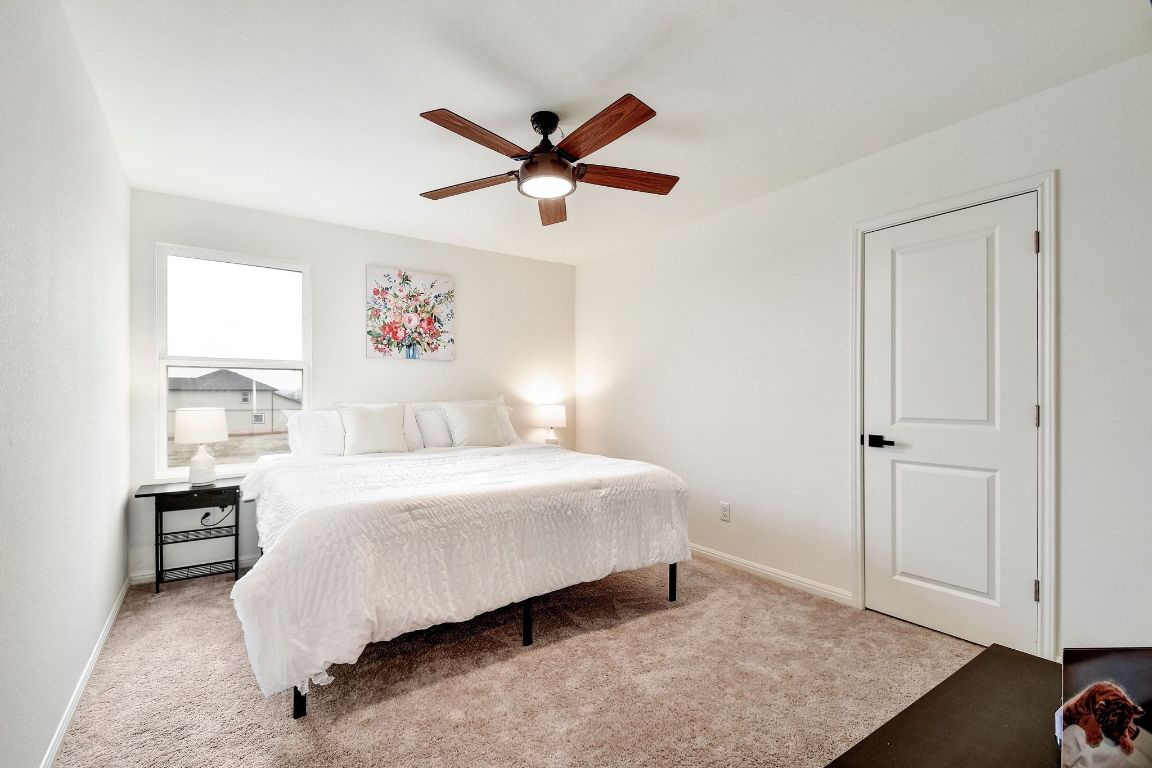 414 Plateau Street Maxwell, TX 78656 - Photo 16 of 25 a bedroom with a bed and a window