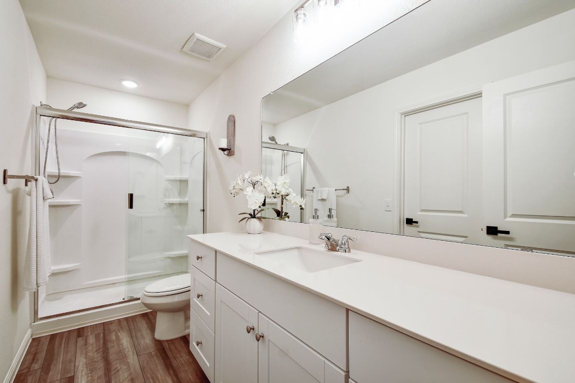 414 Plateau Street Maxwell, TX 78656 - Photo 18 of 25 a bathroom with a sink a toilet and shower