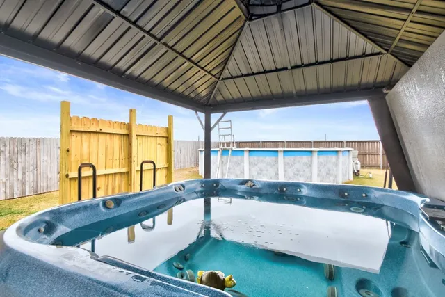a view of a balcony with wooden floor and lake view