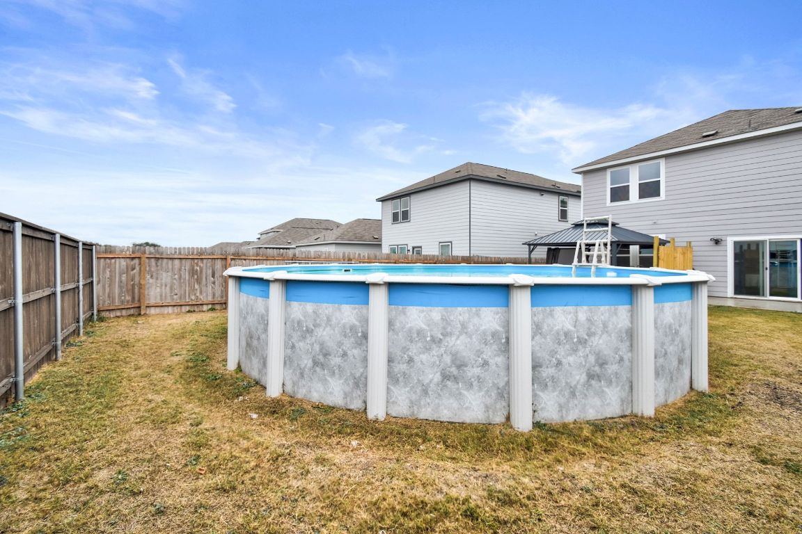 414 Plateau Street Maxwell, TX 78656 - Photo 22 of 25 a view of a house with wooden fence