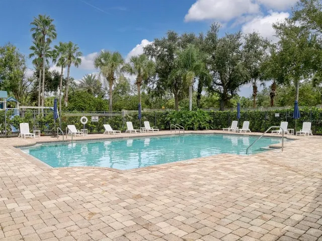 a view of a swimming pool with a yard