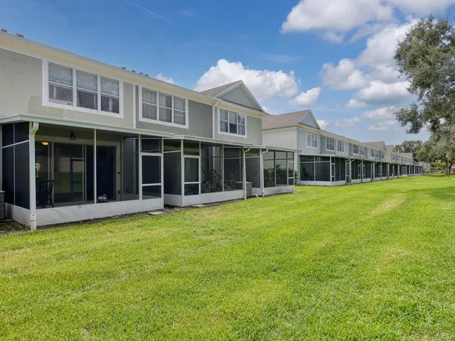 a view of a house with a garden and yard