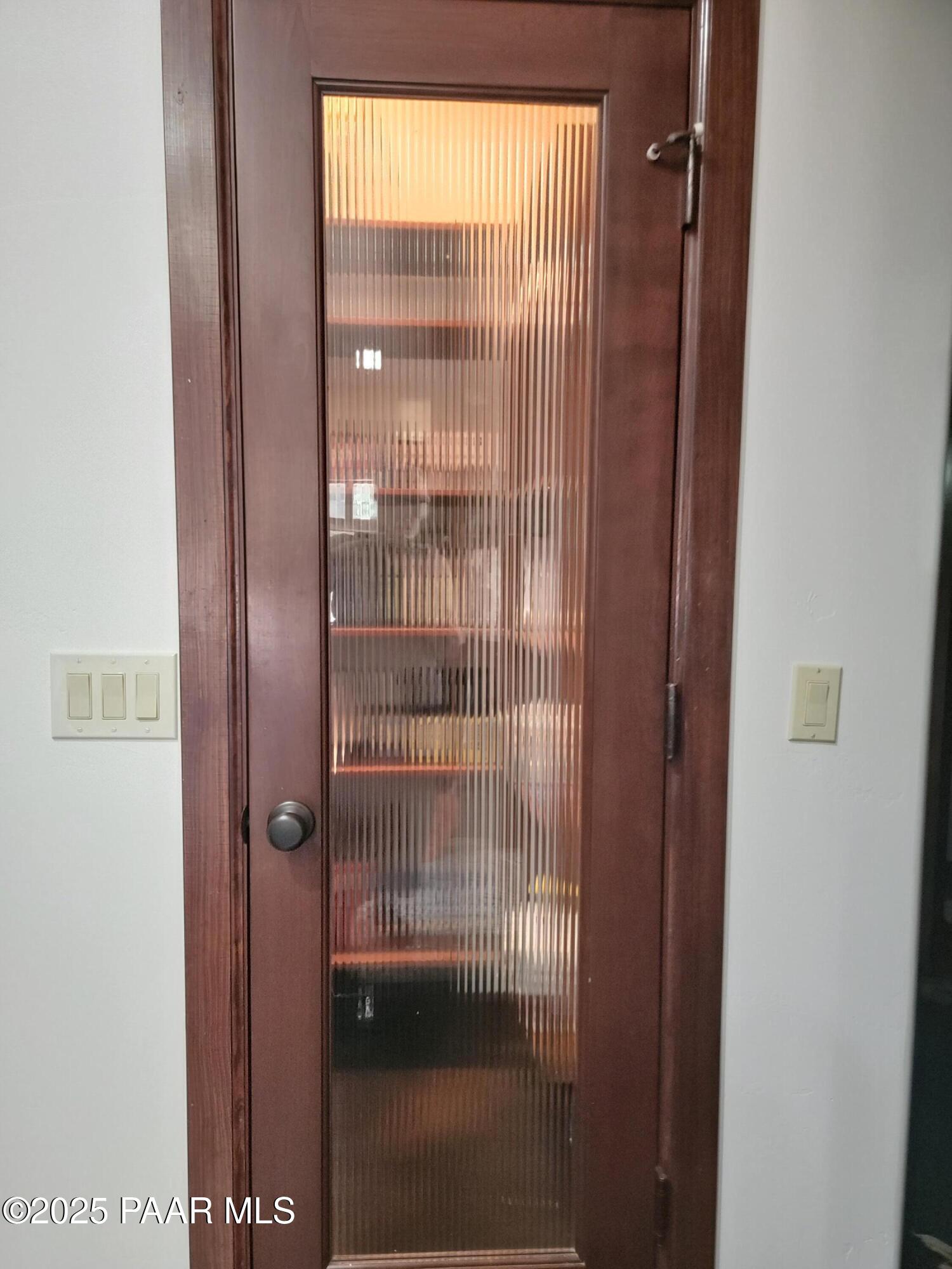 17180 West Model Creek Road Kirkland, AZ 86332 - Photo 17 of 53 a bathroom with a glass shower door