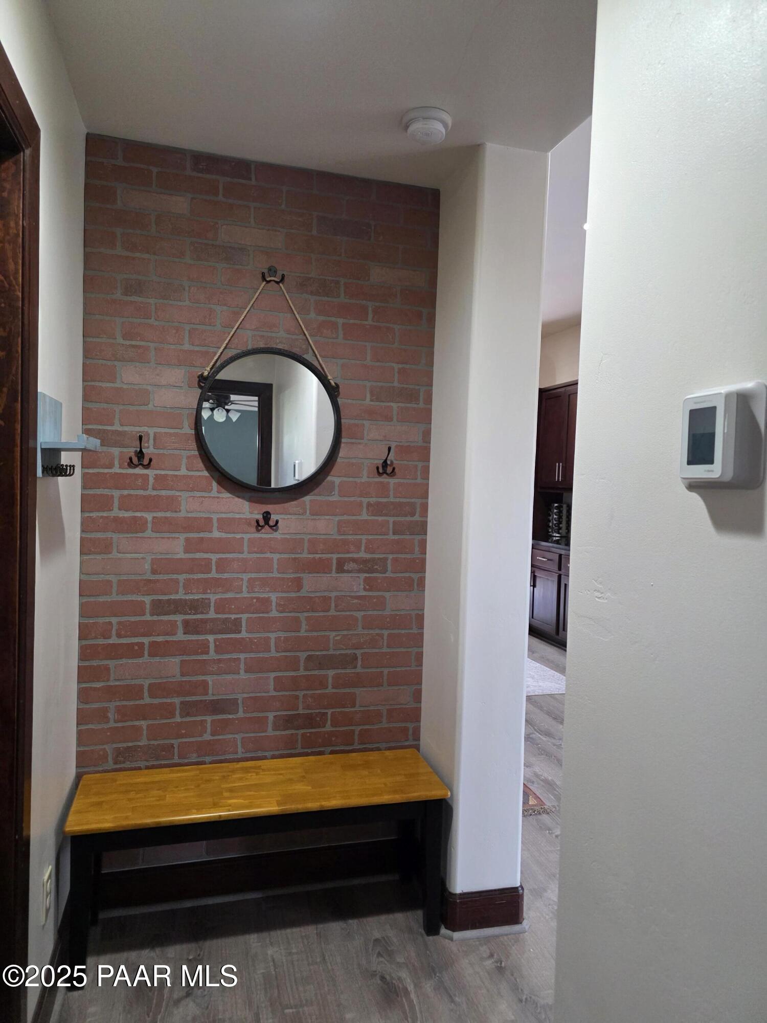 17180 West Model Creek Road Kirkland, AZ 86332 - Photo 19 of 53 a room with a wooden floor and a bathroom