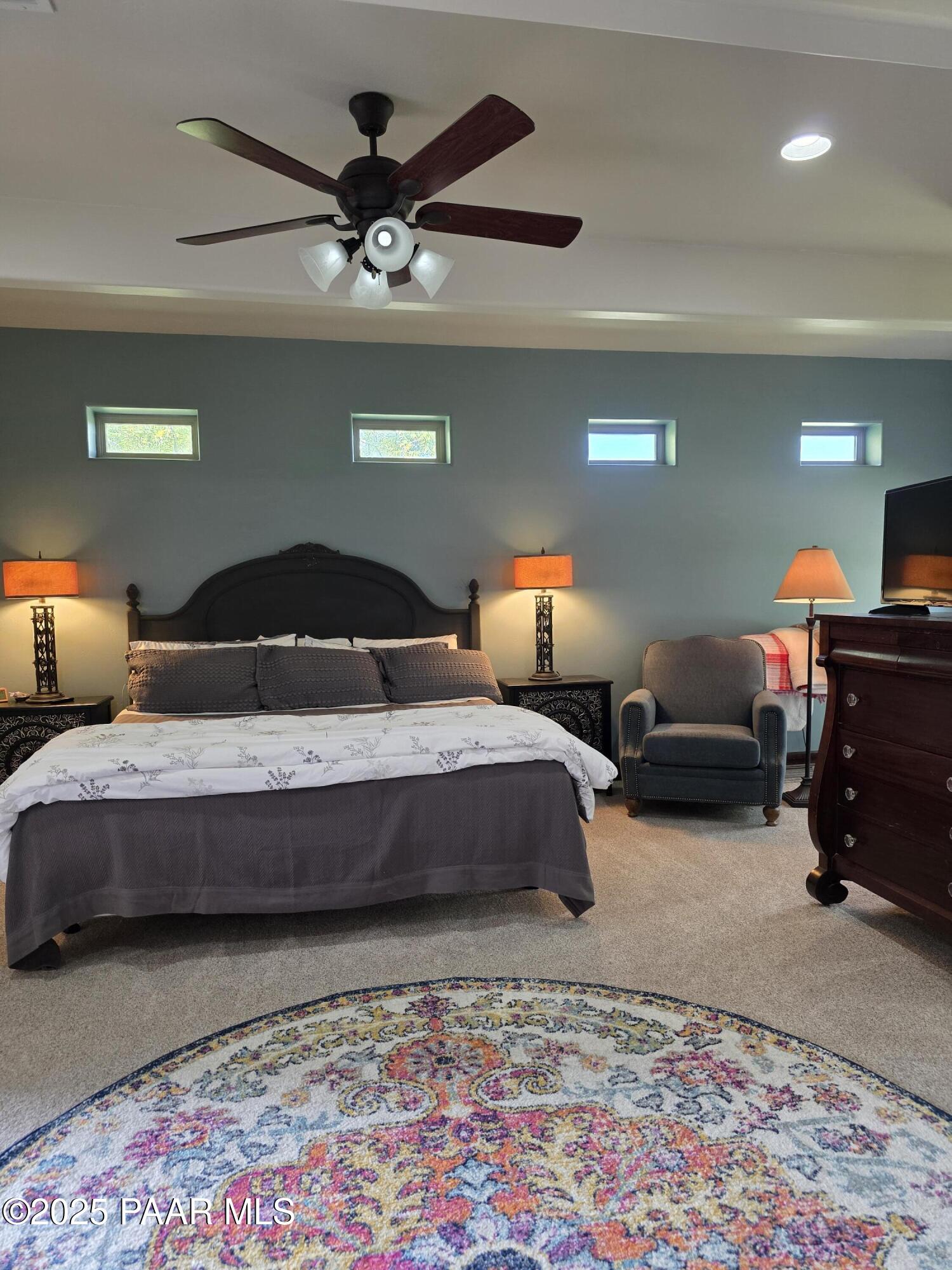 17180 West Model Creek Road Kirkland, AZ 86332 - Photo 25 of 53 a bedroom with bed and a lamp on desk