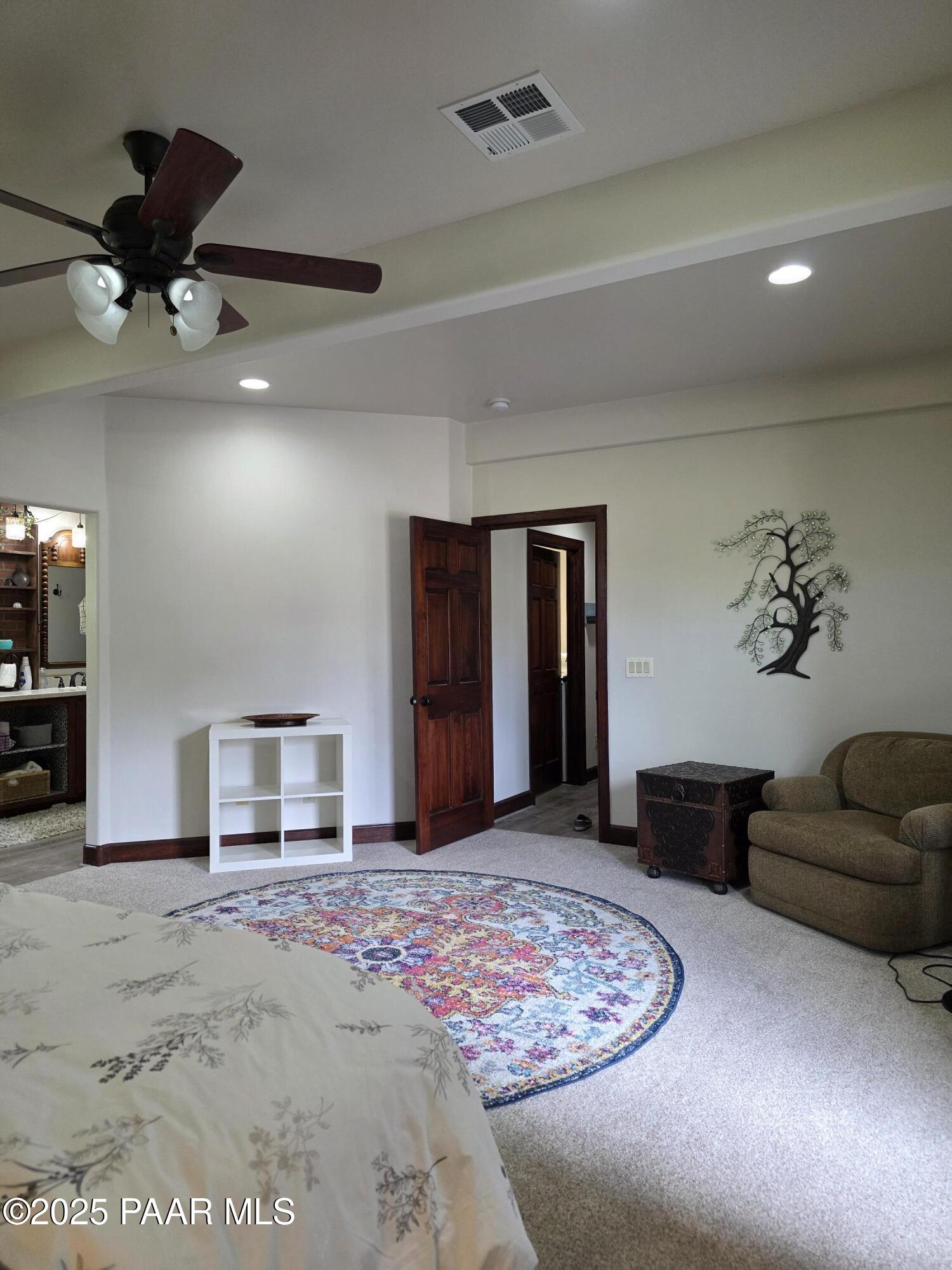 17180 West Model Creek Road Kirkland, AZ 86332 - Photo 27 of 53 a living room with furniture and a flat screen tv